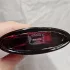 Yves Saint Laurent Black Opium Eau de Parfum Over Red